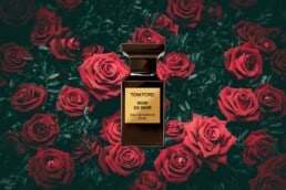 A Bottle of Perfume on a Bed of Roses