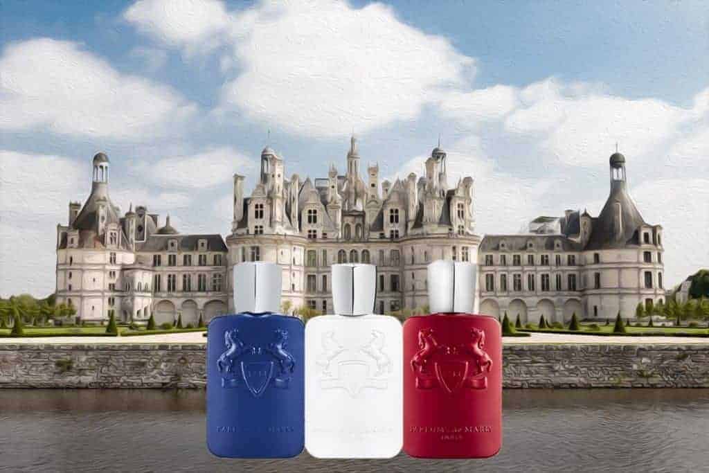 3 different color Parfums de Marly cologne bottles depicted in front of a French Chateau 