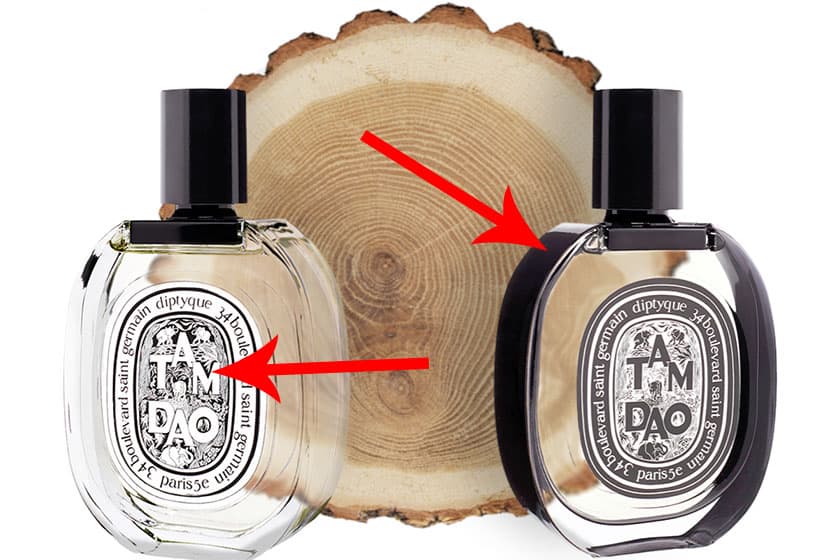 A bottle of Diptyque Tam Dao EDT version next to a bottle of Diptyque Tam Dao EDP version, both in front of the cut end face of a wooden log.