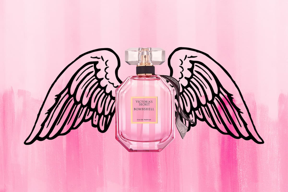 A Victoria’s Secret Bombshell Eau De Parfum bottle depicted with angel wings with a striped light pink colored background.
