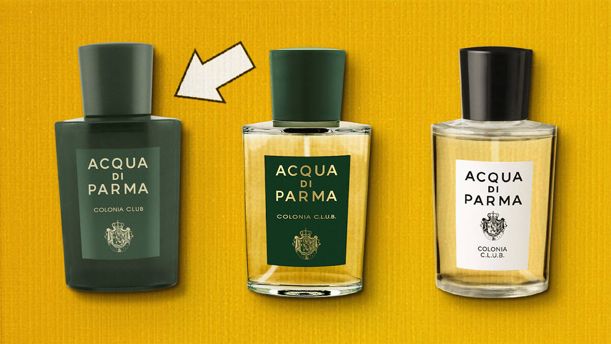 A close-up comparison of the front face of the first released all-green-colored translucent-glass bottle of Acqua Di Parma Colonia Club. To the right of this bottle is a transparent-glass bottle of Acqua Di Parma Colonia C.l.u.b. This bottle has a green-colored label and cap. To the right of this bottle is the latest style transparent-glass bottle of Acqua Di Parma Colonia C.l.u.b., which has a white-colored label and a black-colored cap. All 3 bottles are placed on their side in a row next to each other, label side up, and are resting on a yellow-colored textured surface. There is a white arrow printed on the background surface pointing towards the all green-colored bottle on the left.